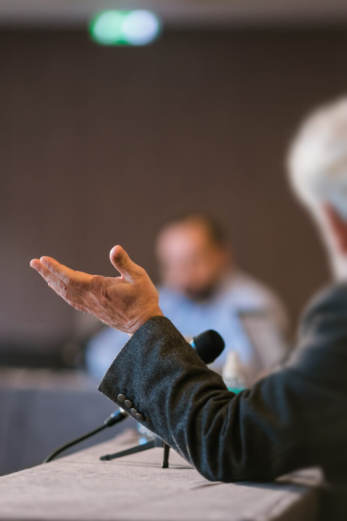 people debating at business presentation